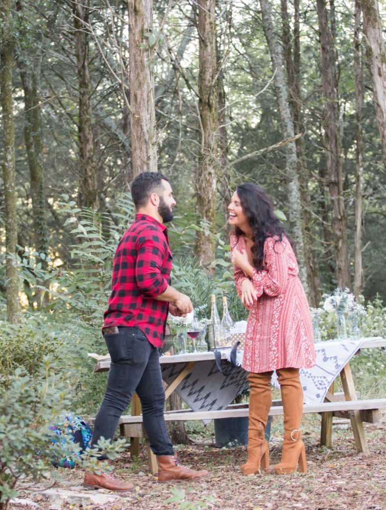 guy getting ready to propose in woods