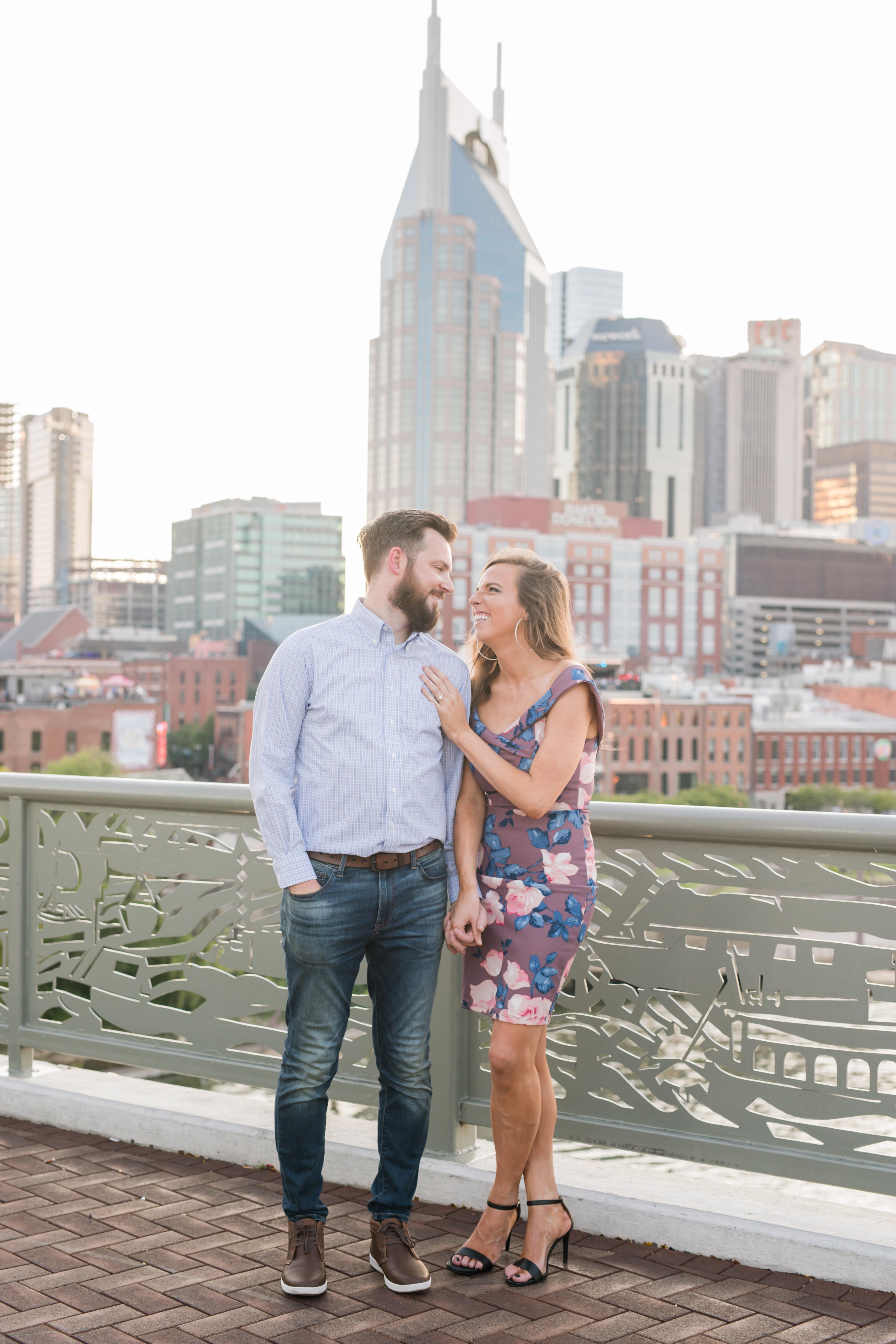 guy and girl looking lovingly at each other nashville skyline