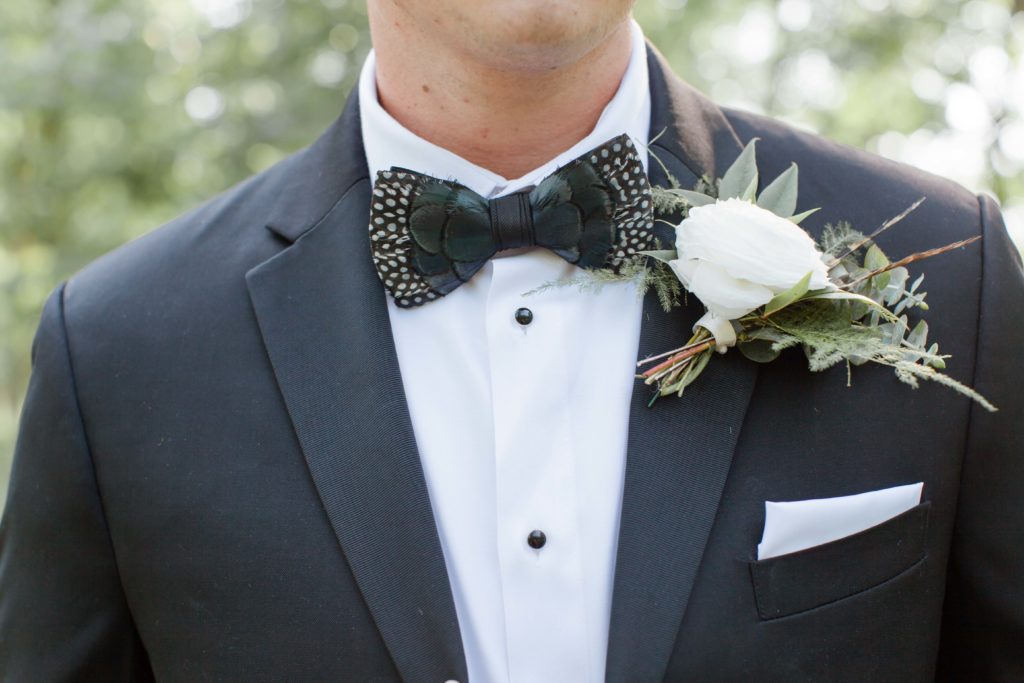 black groom suit with peacock feather bowtie 