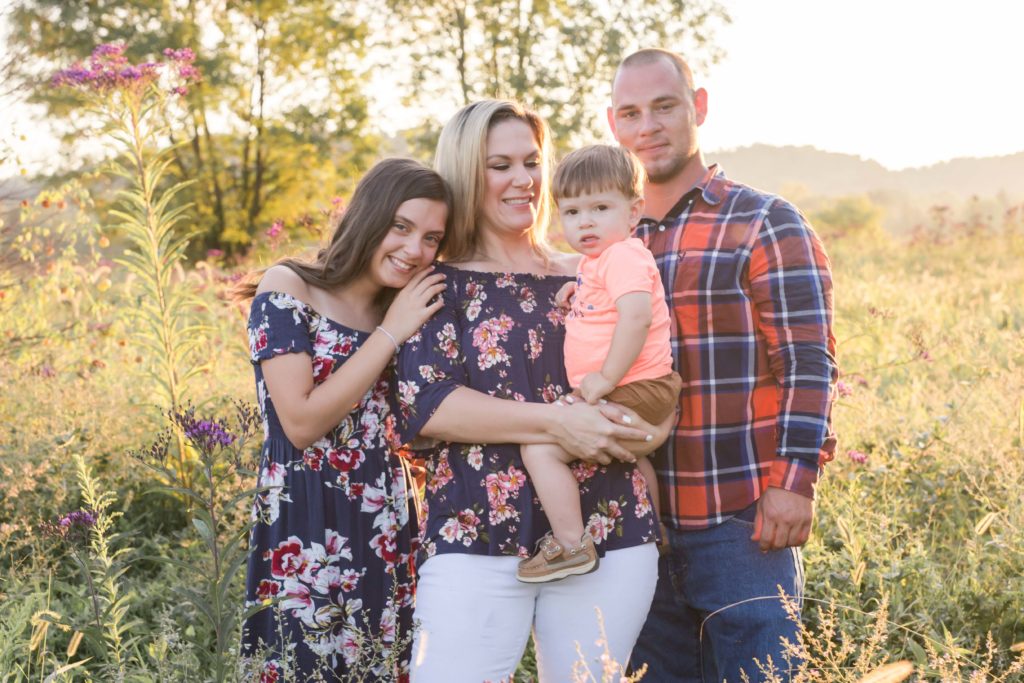 family of four in field photo session in ashland city tn