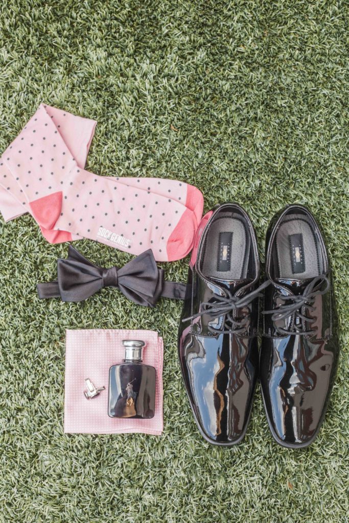 grooms details cologne pink socks shiny black shoes