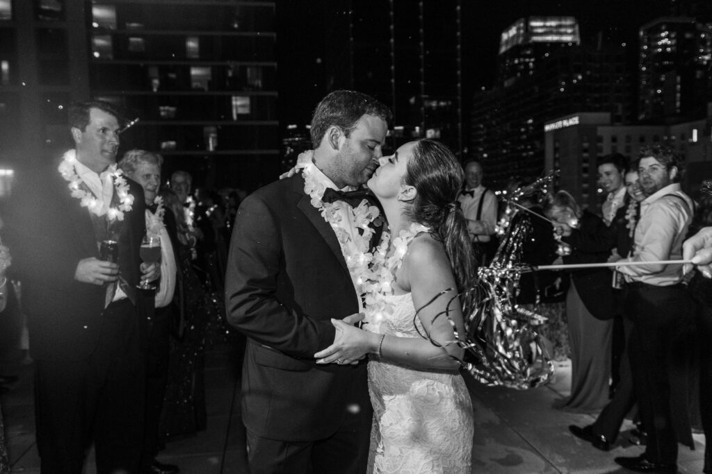 A stunning fake snow exit for a bride and groom on the rooftop on The Joseph Hotel in Nashville.