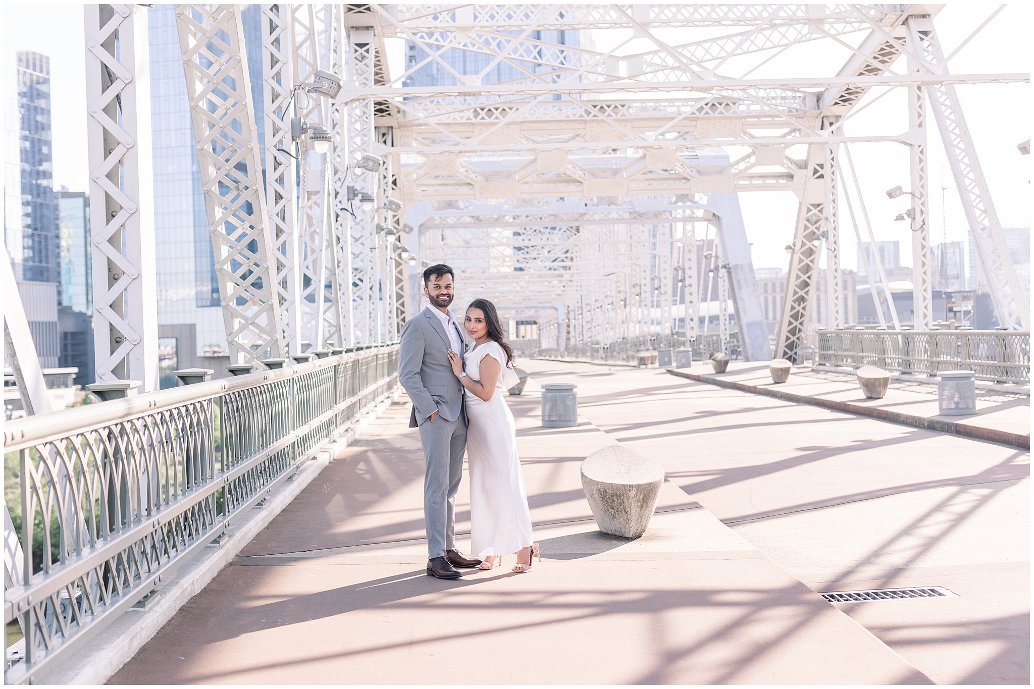 Pedestrian Bridge nashville engagement session couple posing in golden hour light